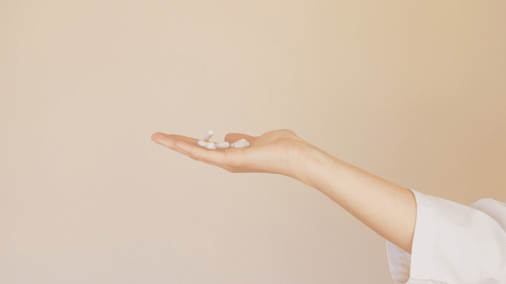 a female hand holding white pills
methadone overdose